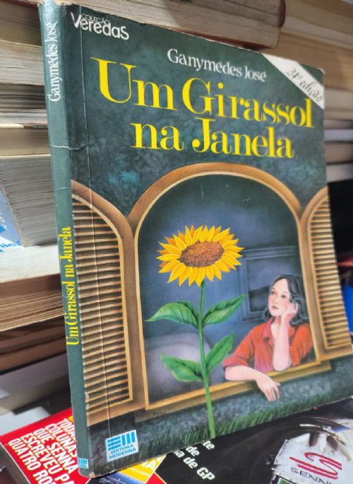 Um girassol na janela